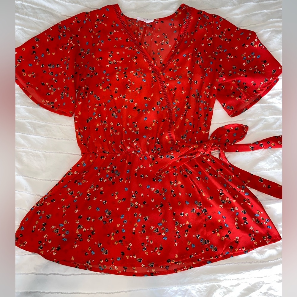 Red floral blouse